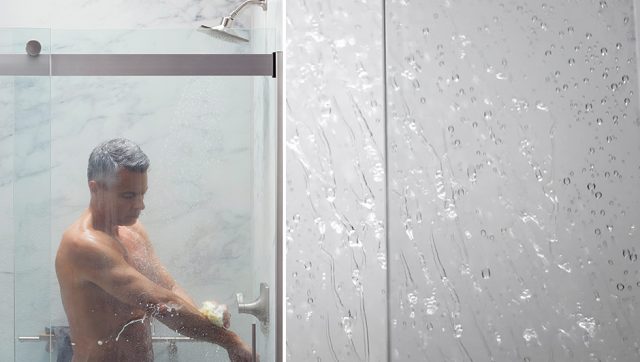man rinsing off in shower