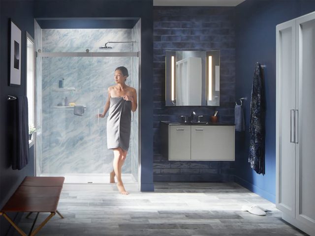 Woman walking out of shower in towel