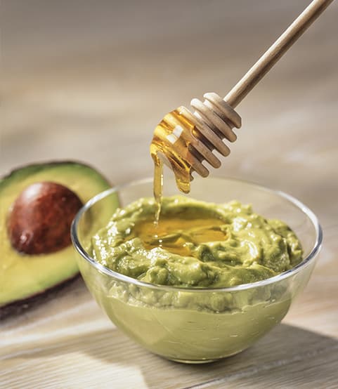 avocado and honey in a bowl