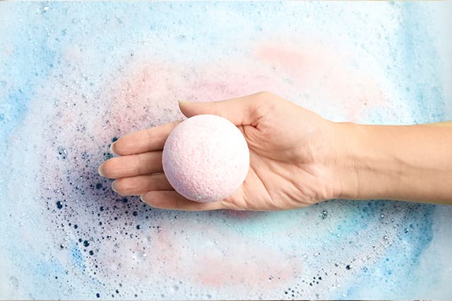 hand holding a bath bomb