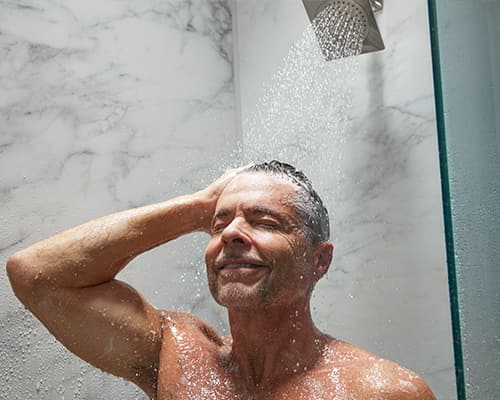 Image of man enjoying LuxStone Shower