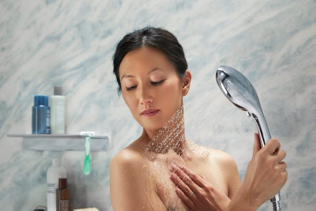 woman using handshower