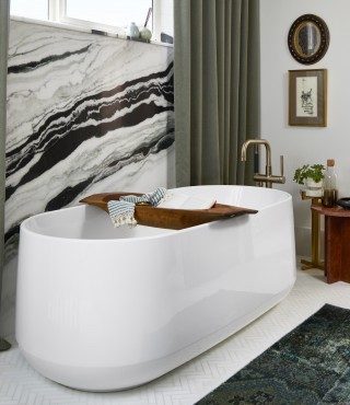 Ceric freestanding bath with hanging wall art.