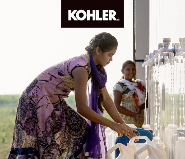 Girl getting water from KOHLER water station'