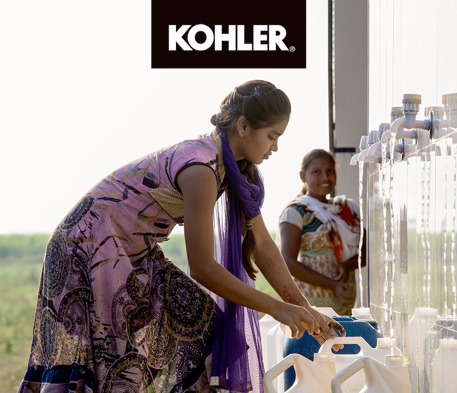 Girl getting water from KOHLER water station