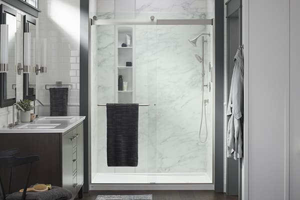 LuxStone shower with grey walls and glass door 