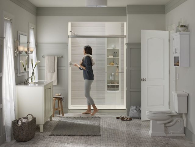 Woman standing outside of shower