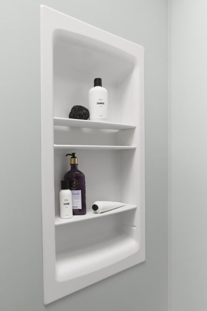 shower shelving with bottles and accessories