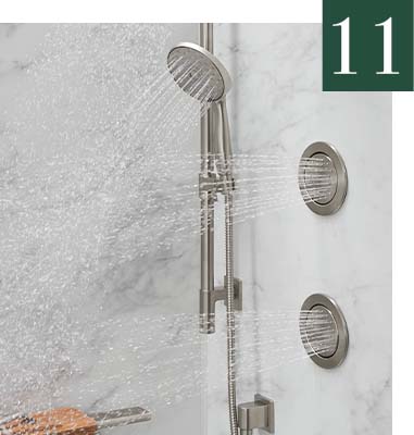 Polished Chrome body sprays and handshower on Calacatta Crema shower walls