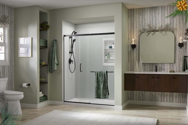 Holiday decorated bathroom featuring LuxStone shower with Ice™ Grey shower walls and Matte Black hardware.'