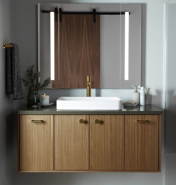 Image of KOHLER vanity with candles and greens