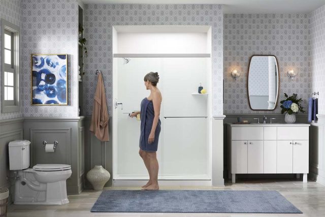 woman opening sliding shower door'