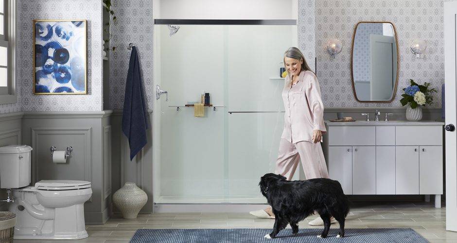 Photo of model walking into bathroom past shower with dog