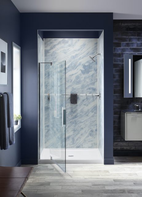 Blue bathroom with pivoting shower door open