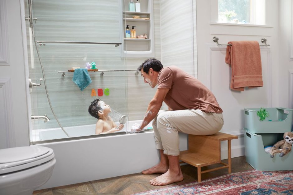 father bathing child