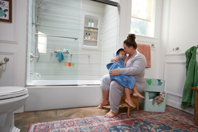 mother drying off child after a bath'