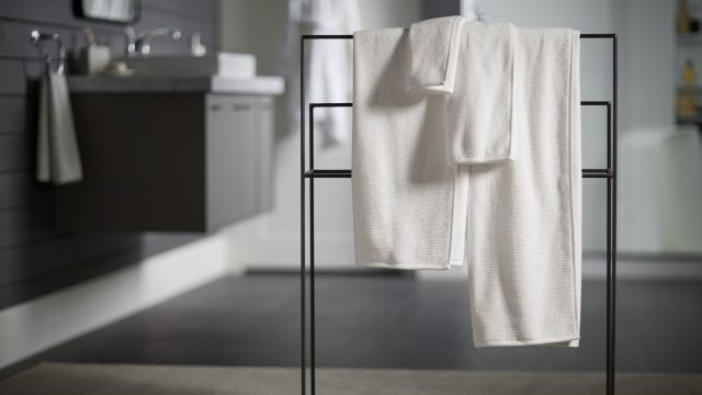 range of towel sizes hanging on a rack