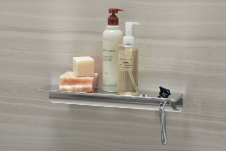 view of floating shelf with accessories placed on top