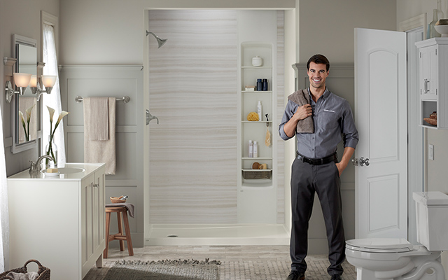 kohler installer standing in bathroom
